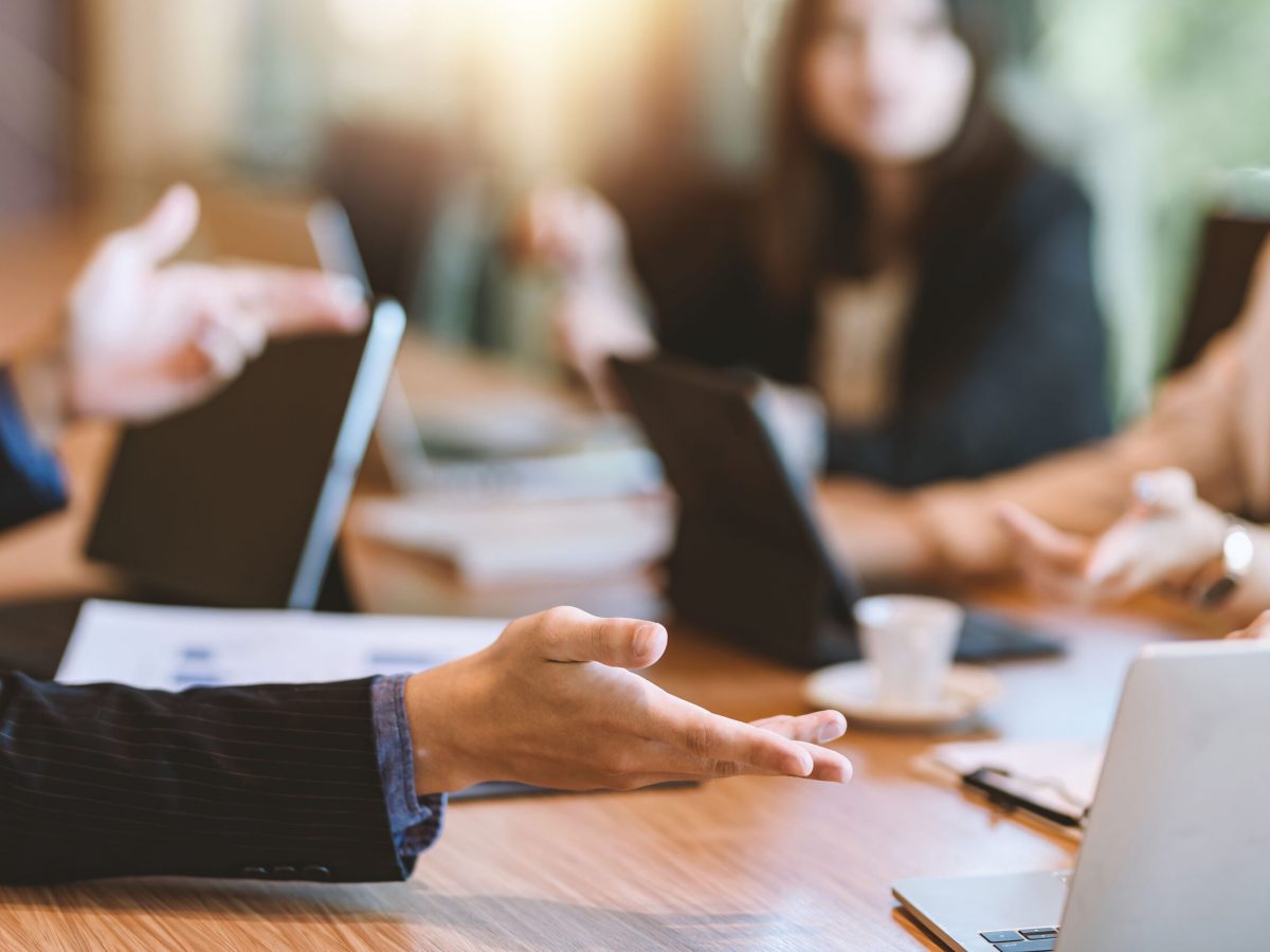 Business people meeting and planning business strategies together in the office.